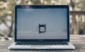 Macbook laptop computer showing the Golden Gate Bridge on a foggy day